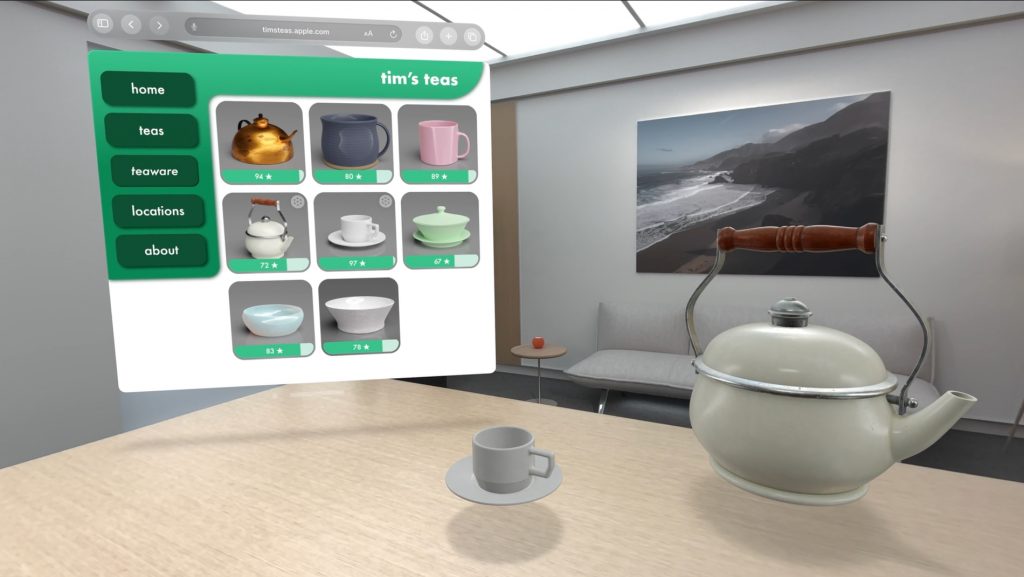 A Safari window floating in space, showing a tea shop website, offering teapots and tea cups for sale. On a table in the room, sits a virtual tea cup and teapot — from the website. 