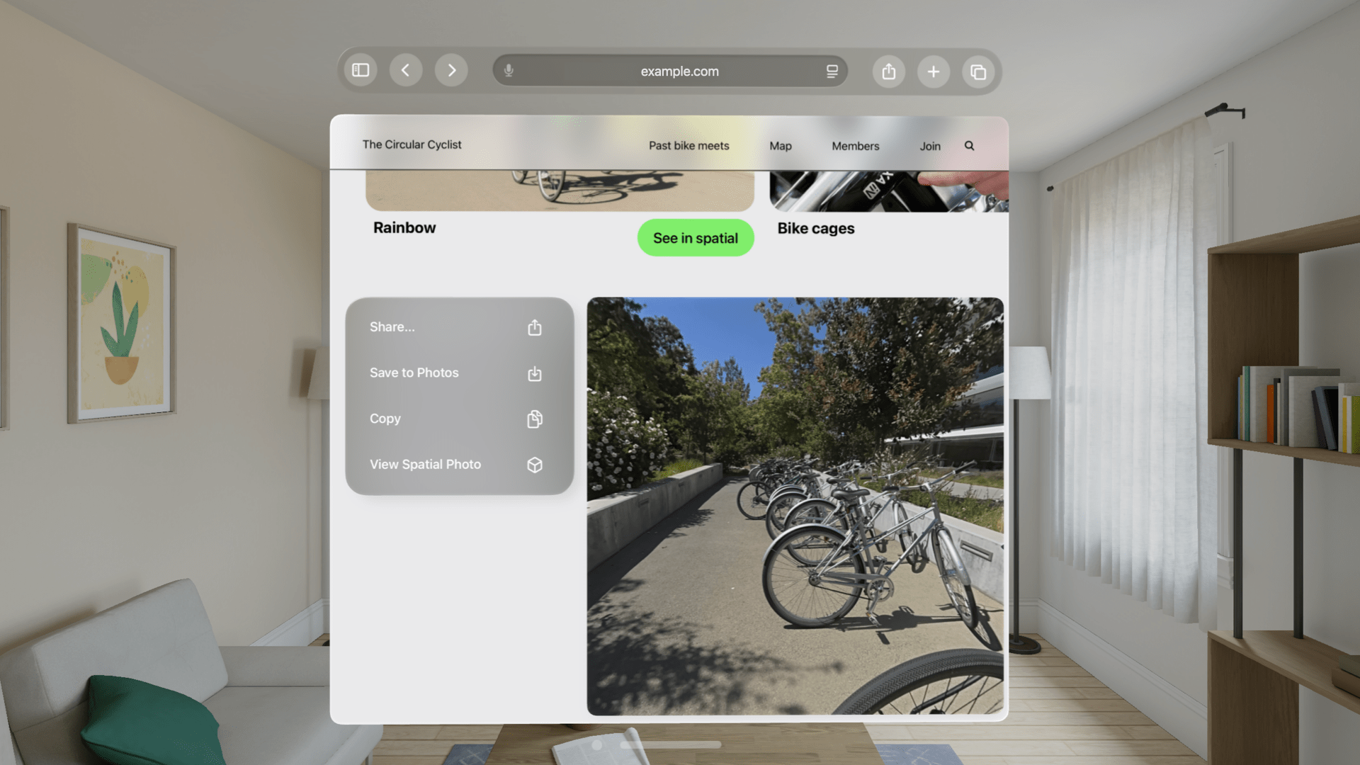 a webpage floating in visionOS, with an image on the page, and a menu popped open next to it with View Spatial Photos as an option
